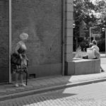 Those were the days: An old women looks to a young couple with mixed feelings