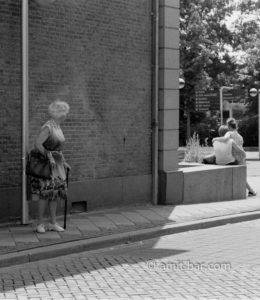 Those were the days: An old women looks to a young couple with mixed feelings