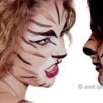 Tigers I: Male and female body-painted models in tigers stripes