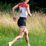 Triathlon athlete III: Body-painted triathlon athlete is running