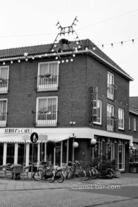 Trinity: A man is working on the roof of Trinity cafe in Doetinchem, The Netherlands