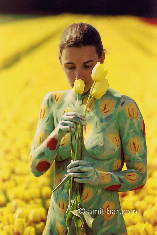 Tulips IV: Portrait of body-painted model with tulips in the fields