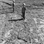 Water pipes: Two children with irrigation water pipes