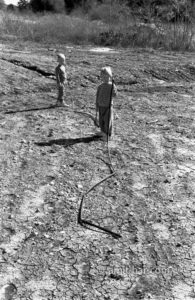 Water pipes: Two children with irrigation water pipes