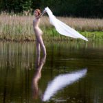White sheet: A nude model in the lake with a white sheet
