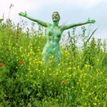 Wild spring flowers II: Body-painted woman with wild flowers