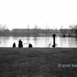 Willows, bikes, fishermen and reflections: Fishermen at a lake in Doetinchem